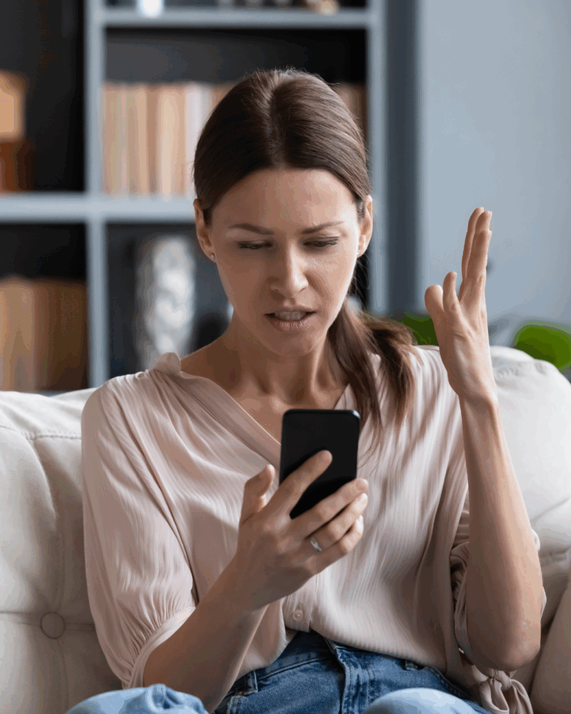 Rage Bait - Image of frustrated girl looking at her cell phone