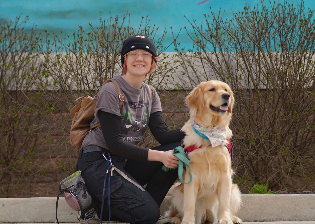 Transcend Ideas intern, Hannah Lendeman, with her dog she trained.